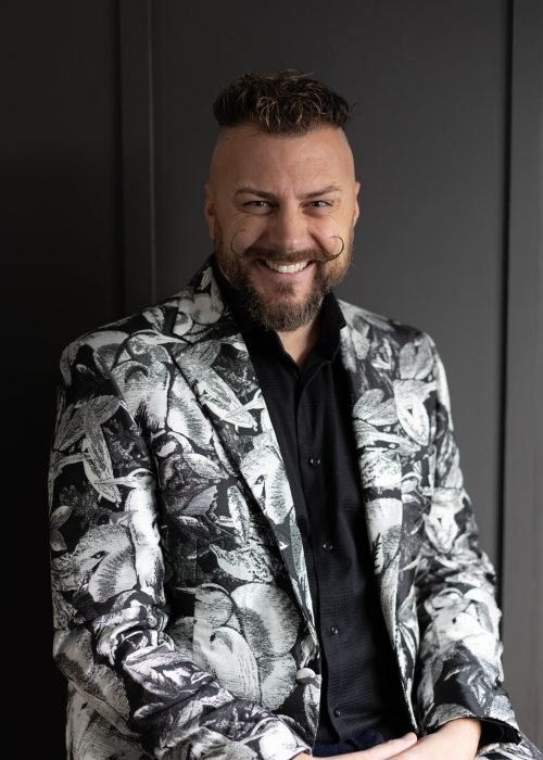 Man in front of black background